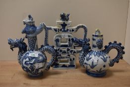 A 19th Century Chinese blue and white dragon ewer, measuring 25cm high, together with two others
