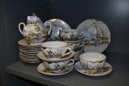 An early 20th Century Japanese egg shell tea set, hand decorated with traditional scenes and
