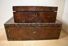 Two Victorian walnut writing slopes, the largest having a metal inlaid border and measuring 17cm x