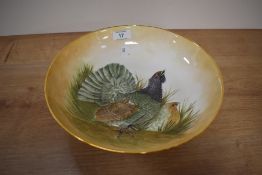 A 20th Century hand painted pottery fruit bowl by Rita Blyth, decorated with a bird design and