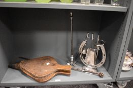 A 20th Century chromed metal horseshoe companion stand with irons, measuring 28cm high, and a pair