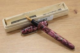 A Conway Stewart 75 lever fill fountain pen in pink marble with single band to the cap having a