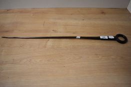 A 19th Century metal meat skewer with bull ring handle, measuring 60cm long