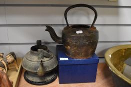 A 19th Century bronzed metal kettle, of Eastern design with missing handle, measuring 16cm high,