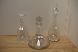 A late 20th Century clear glass ship's decanter and stopper, with etched inscription and measuring