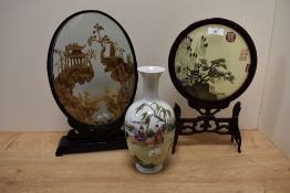 A late 19th Century Chinese cased diorama, the ebonised oval case enclosing an intricately carved