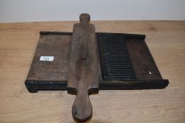 A 19th Century brass mounted pill rolling machine, measuring 36cm long