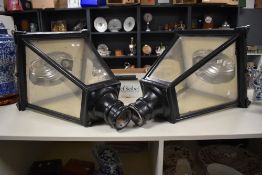 A pair of large 20th Century four glass sided outdoor lanterns, finished in black and measuring 95cm