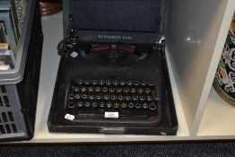 A vintage cased Remington Deluxe Model 5 typewriter