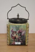 An early 20th Century Carlton Fantasia Ware biscuit barrel, having a white metal lid and handle,