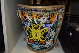 A 20th Century beaded Borneo papoose, measuring 37cm high