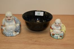 Two 19th/20th Century hand painted seated Buddha studies, the largest measures 9cm high, and a tea