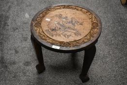 A late 19th Century Chinese carved jardiniere stand, the surface carved an inlaid with an exotic