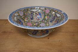 A 19th Century Chinese porcelain bowl, decorated with panels of traditional scenes amongst