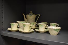 A Grafton china coffee set, the design featuring hand painted green petalled flowers, comprising