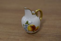 A miniature dolls Royal Worcester bone china tusk jug, decorated with foliate sprays and gilt