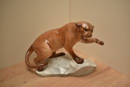 A Beswick Pottery Puma mounted on rock, model number 1702 desgined by Arthur Gredington in black and