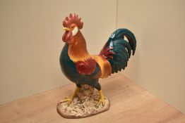 A Beswick Pottery Leghorn Cockerel model number 1892 in teal green, red, oragne and yellow gloss