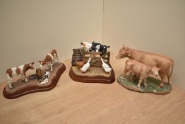 A Sherratt & Simpson hand painted Limousin cow and calf group, number 57439, 12.5cm high together