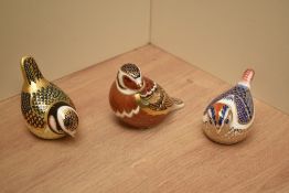 Three Royal Crown Derby bone china paperweights comprising Goldcrest, Partridge and Blue Tit all