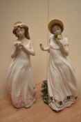 Two Zaphir, Spain, ceramic female figures both presenting flowers standing at 42cm tall wiht one