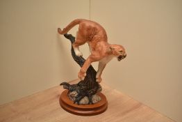 A Franklin Mint fine porcelain figure 'The Defender' on wooden plinth.
