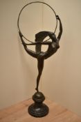 An Art Deco design patinated metal figure, in the style of Jean Pierre Morante 1882-1960, of a