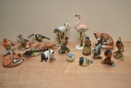 Sixteen Kaiser West Germany hand painted porcelain animal studies comprising curled up red fox