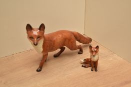 A Beswick Pottery Fox-standing, number 1016a, designed by Arthur Gredington in red, brown and