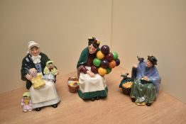 Three Royal Doulton bone china figurines comprising 'The Rag Doll Seller' HN 2944, 'The Old