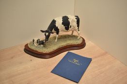 A Border Fine Arts Holstein Friesian Cow & Calf, model no B0309 by Kirsty Armstrong. Number 87/