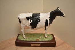 A John Harper Shebeg Pottery (Isle of Man) limited edition study of a Friesian cow, modelled