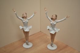 A pair of German Wallendorf porcelain ice skater figurines, modelled in victorious pose with arm