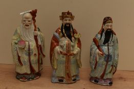 A group of three Chinese porcelain immortal figures, depicting Sanxing (deities) Lu Xing, Shou