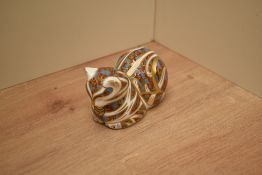 A Royal Crown Derby bone china Contented Cat paperweight having silver coloured stopper to