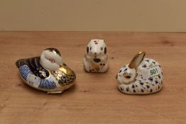 A group of three Royal Crown Derby bone china animal form paperweights, comprising a duck, field