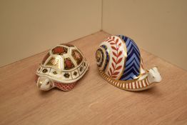 Two Royal Crown Derby bone china paperweights Snail and Turtle both having silver coloured stopper