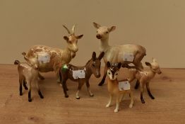 A small collection of Beswick Pottery, comprising a goat, number 1035, designed by Arthur Gredington