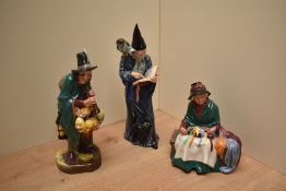 Three Royal Doulton bone china figures comprising 'The Mask Seller' HN 2103, 'Silks and Ribbons'