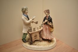 A large Capodimonte figural group 'The Pharmacist' with no marking to base and stands at 35cm.