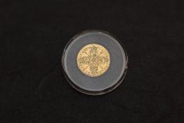 A 1718 George I Gold Quarter Guinea, Laurel Head, Shields & Sceptres