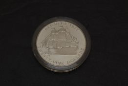 A Bermuda Monetary Authority 1977 Silver Twenty Five Dollar Coin, Queen's Silver Jubilee, in capsule