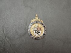 A Liverpool & Dist Church of England Sports League 9ct .375 Gold Medal with enamel decoration,