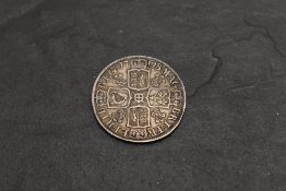 A 1708 Queen Anne Silver Half Crown, Plumes in Angles, Septimo on edge, in good condition with no