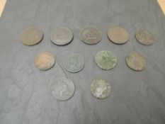 Eleven GB Copper and Brass Coins and Tokens including a 1797 Penny