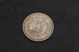 A 1883 USA Morgan Silver Dollar