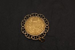 A 1869 Queen Victoria Gold Sovereign, Young Head, Shield Back, Die Number 25, Royal Mint, in a 9ct