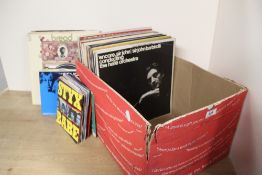 A box of random vinyl albums and 45's as in photos - viewing recommended