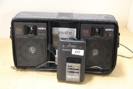 A nice retro Sony Walkman in a carry case with speakers