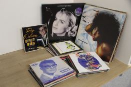 A vinyl lot of albums and 45's - as in photos - approximately sixty records in total